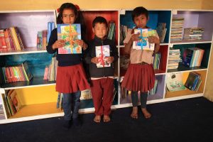 Taltuleshwori School star readers with their prizes posing for a group photo.