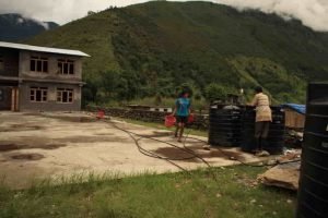 The multi-purpose court & PVC water tanks to address WASH issues at the school.