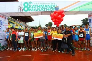 Bimala at the starting line promoting our campaign just before taking off for her half-marathon.