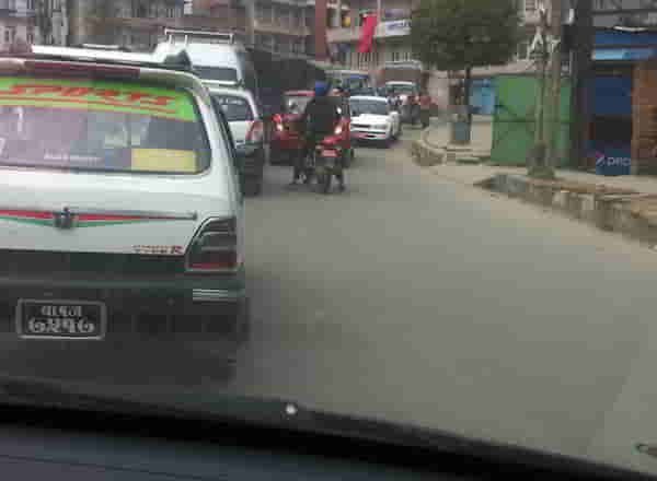 2. Red car followed by a motorcyle 09.56.23