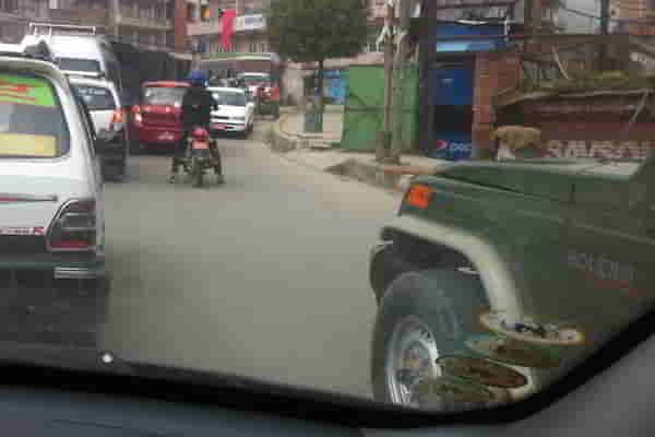 3. Red car followed by a motorcyle & army jeep 09.56.26