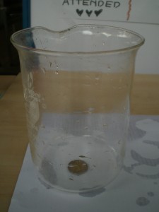 coin under beaker - no water